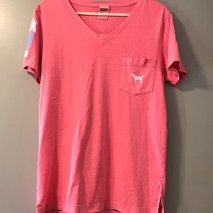 PINK shirt. Size XS. Dog on front and back, writing on one sleeve
